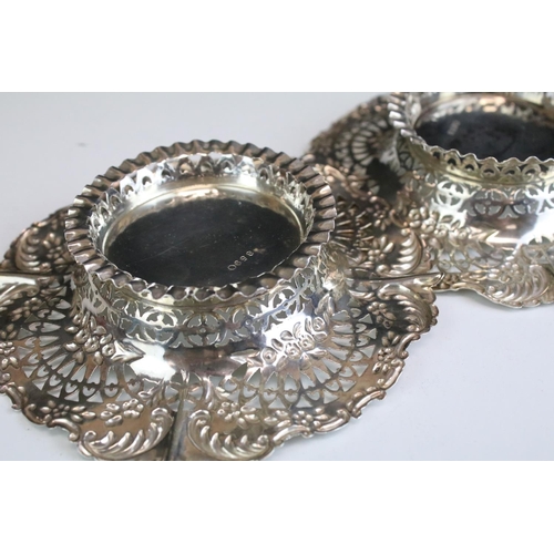 655 - Pair of Victorian silver hallmarked pin dishes each having pierced rims with moulded floral details.... 