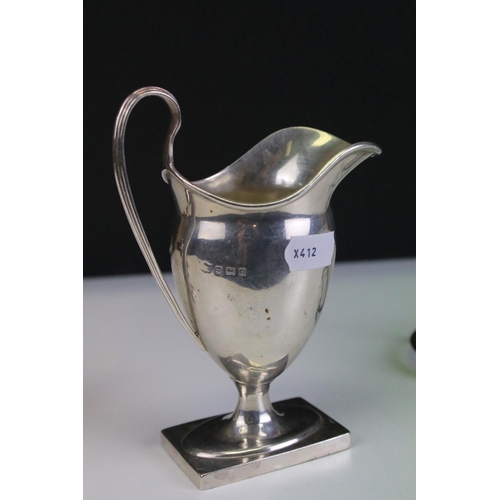 657 - Collection of antique silver hallmarked items to include a cream jug of helmet form (hallmarked Birm... 