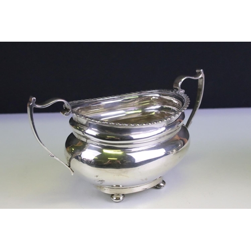 665 - Early 20th century silver twin-handled sugar basin & milk jug, of plain polished baluster form with ... 