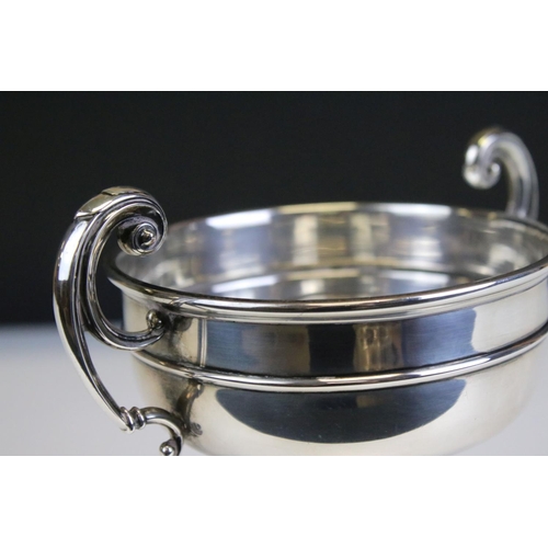 672 - 1920s William Hutton & Sons silver hallmarked trophy cup having twin scrolled handles raised on a pe... 