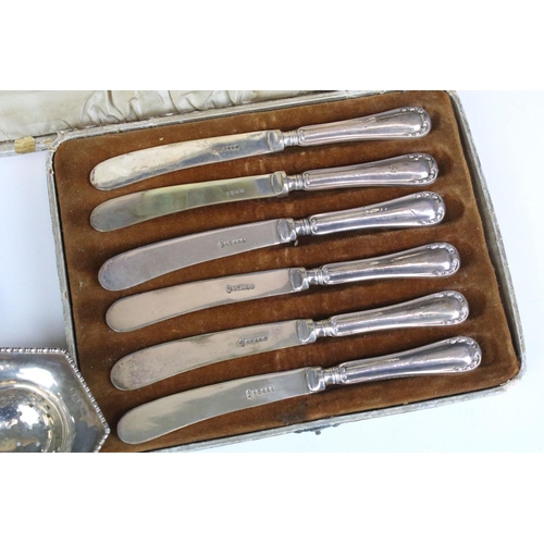 674 - Set of silver handled butter knives (hallmarked Sheffield 1919), silver tea strainer with turned ebo... 