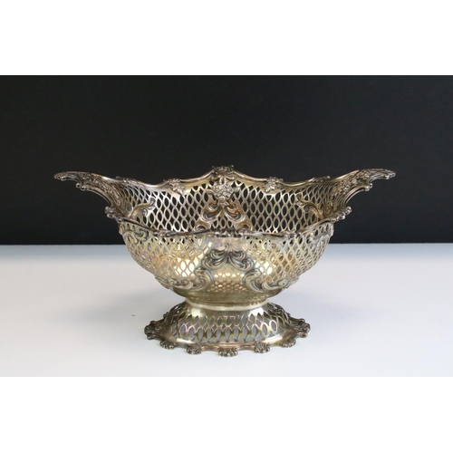 677 - Early 20th Century silver hallmarked basket of pierced form having moulded scrolled rims with floral... 