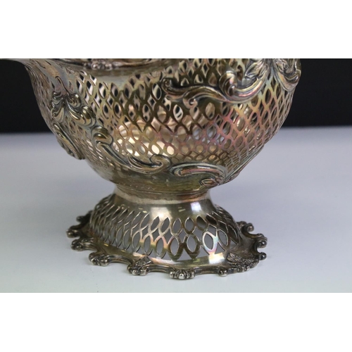 677 - Early 20th Century silver hallmarked basket of pierced form having moulded scrolled rims with floral... 