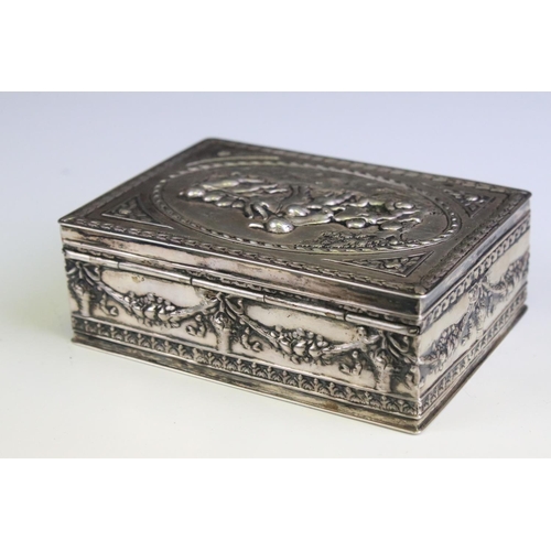 680 - Early 20th Century continental silver lidded box having moulded classical detailing featuring putti ... 