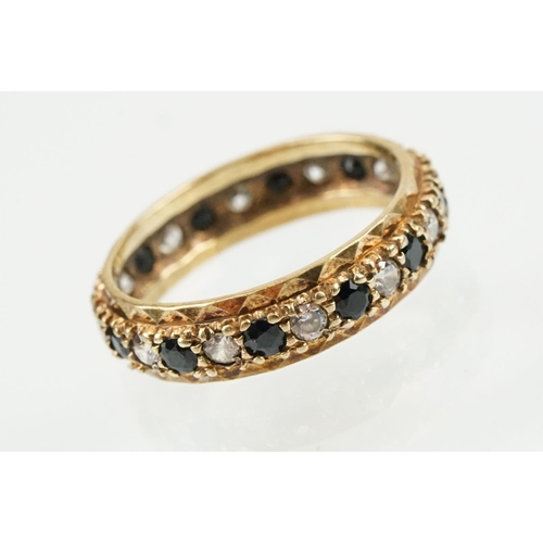 397 - Three rings to include a blue stone and cz eternity ring (hallmarked Birmingham, size N), a silver b... 