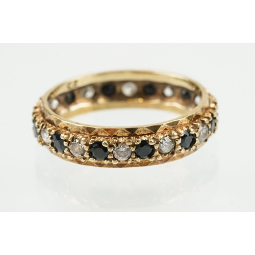 397 - Three rings to include a blue stone and cz eternity ring (hallmarked Birmingham, size N), a silver b... 