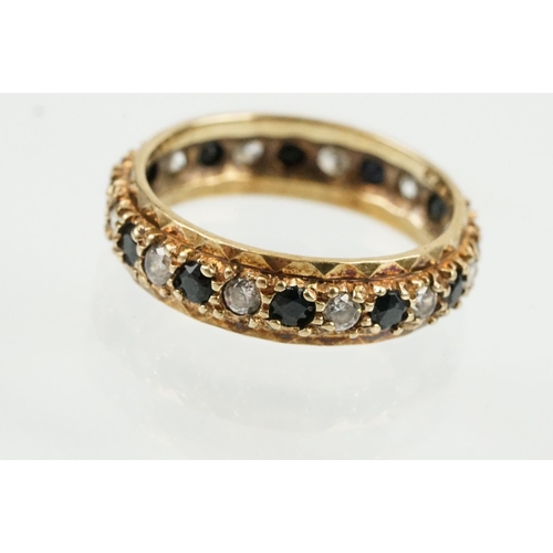 397 - Three rings to include a blue stone and cz eternity ring (hallmarked Birmingham, size N), a silver b... 