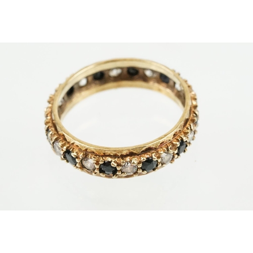 397 - Three rings to include a blue stone and cz eternity ring (hallmarked Birmingham, size N), a silver b... 