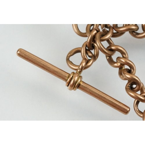 398 - 9ct gold hallmarked double albert chain with 9ct T bar and 9ct enamelled fob medal. The chain constr... 