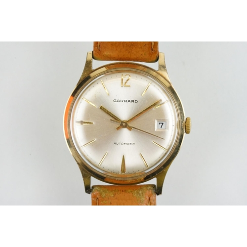 505 - Garrard automatic gold plated wrist watch having a silver tone sunburst dial, gilt baton markers to ... 