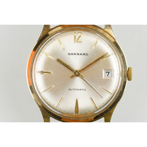 505 - Garrard automatic gold plated wrist watch having a silver tone sunburst dial, gilt baton markers to ... 