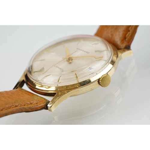 505 - Garrard automatic gold plated wrist watch having a silver tone sunburst dial, gilt baton markers to ... 