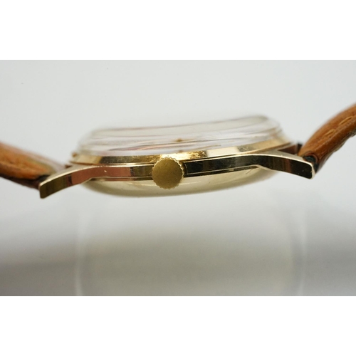 505 - Garrard automatic gold plated wrist watch having a silver tone sunburst dial, gilt baton markers to ... 