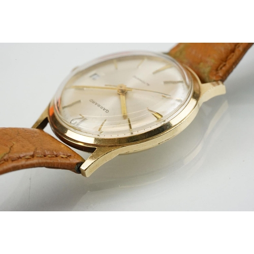 505 - Garrard automatic gold plated wrist watch having a silver tone sunburst dial, gilt baton markers to ... 