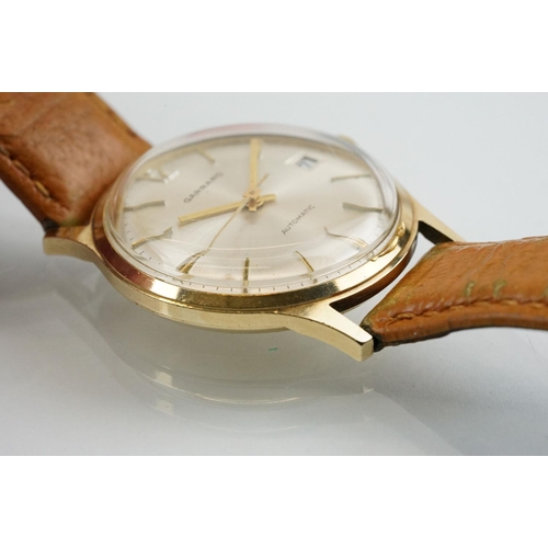 505 - Garrard automatic gold plated wrist watch having a silver tone sunburst dial, gilt baton markers to ... 