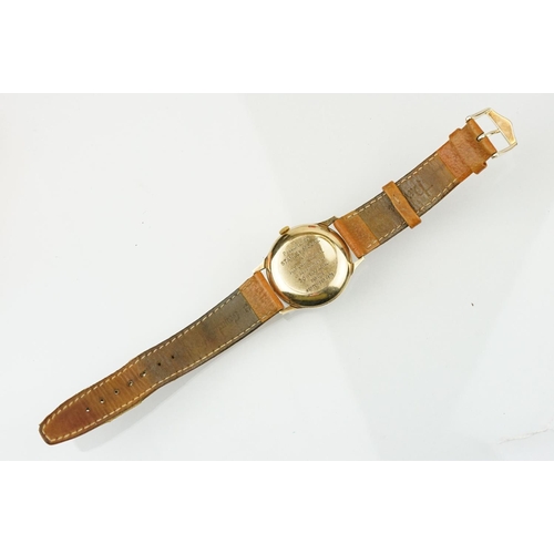 505 - Garrard automatic gold plated wrist watch having a silver tone sunburst dial, gilt baton markers to ... 