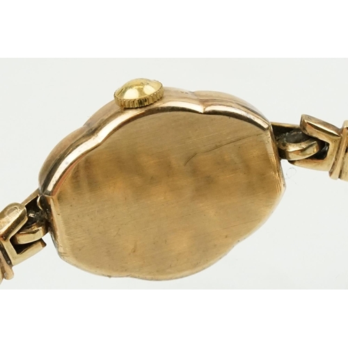 506 - 9ct gold Tudor ladies wrist watch having a round face with baton markers to the chapter ring mounted... 