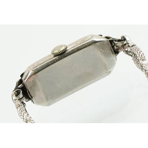 508 - Early 20th Century platinum and diamond cocktail watch having a rectangular face with arabic numeral... 