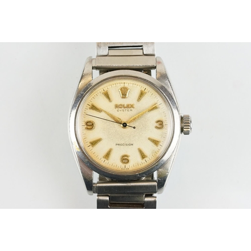 509 - Rolex Oyster Precision stainless steel wrist watch having a round textured dial with triangular bato... 