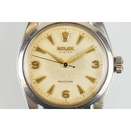 509 - Rolex Oyster Precision stainless steel wrist watch having a round textured dial with triangular bato... 