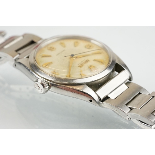 509 - Rolex Oyster Precision stainless steel wrist watch having a round textured dial with triangular bato... 