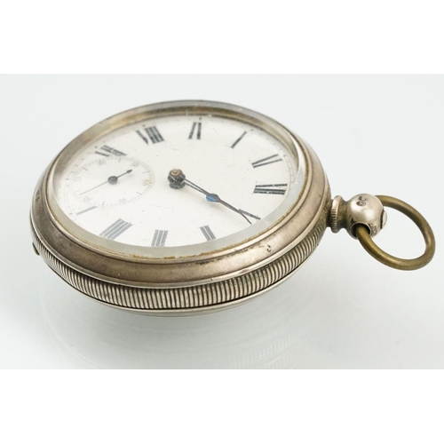 512 - Victorian silver open faced pocket watch having a white dial with roman numerals to the chapter ring... 