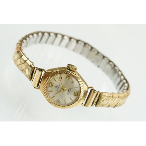 520 - 9ctr gold cased verity cocktail watch having a silvered face and expandable bracelet strap. Case mar... 