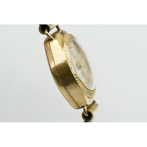 520 - 9ctr gold cased verity cocktail watch having a silvered face and expandable bracelet strap. Case mar... 