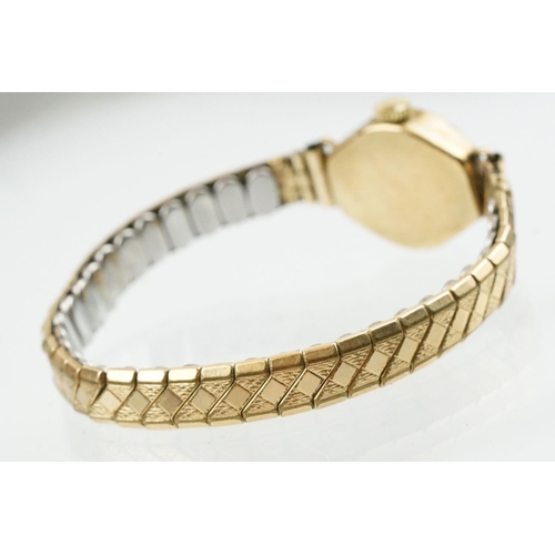 520 - 9ctr gold cased verity cocktail watch having a silvered face and expandable bracelet strap. Case mar... 