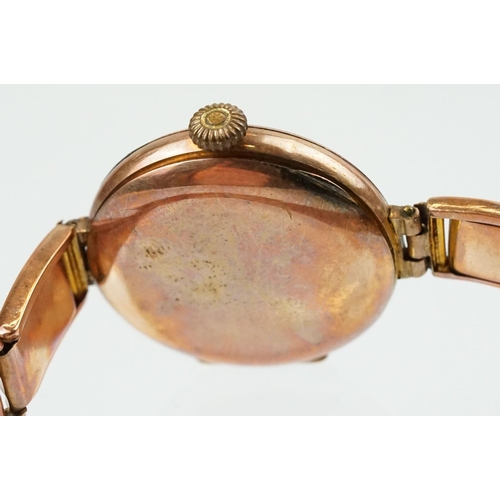 527 - Early 20th Century 9ct gold hallmarked wrist watch. The watch having a round white enamelled face wi... 