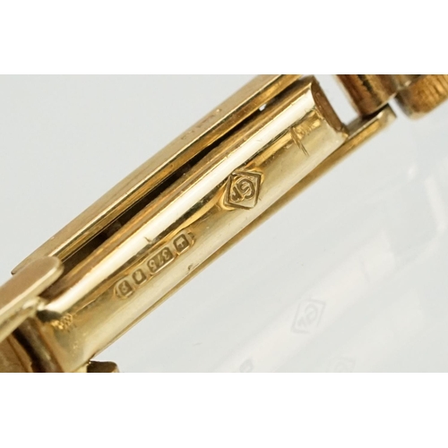 528 - Ladies Everite 9ctr gold wrist watch having a canted rectangular dial with baton markers to the chap... 