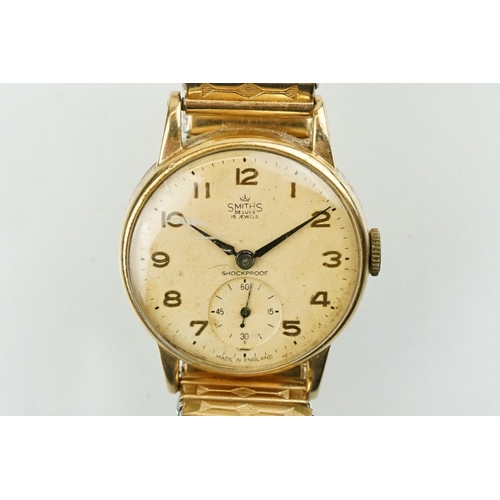 531 - Smiths De Luxe 9ct gold cased gentlemen's wrist watch having a round face with arabic numerals to th... 