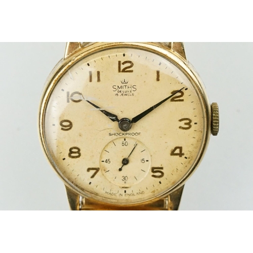 531 - Smiths De Luxe 9ct gold cased gentlemen's wrist watch having a round face with arabic numerals to th... 