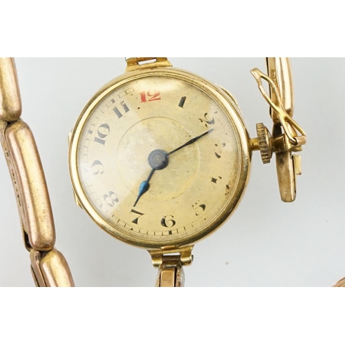 541 - Four gold cased wrist watches to include a red cord watch with 9ct case and strap, a 15ct gold gilt ... 