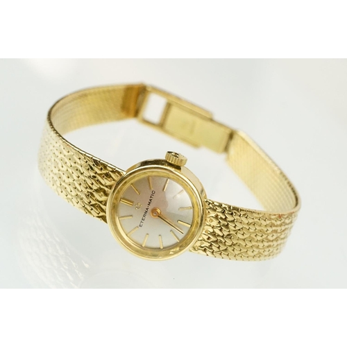 542 - 18ct gold ladies Eterna-matic 18ct gold cocktail wrist watch having a round face with baton markers ... 