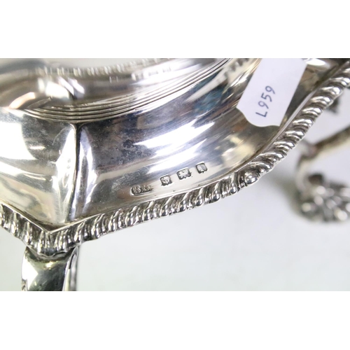 550 - Early 20th Century four piece silver hallmarked tea set to include tea pot, twin handled sugar bowl,... 