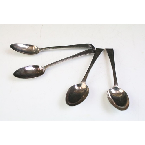 578 - Set of four 18th Century silver spoons each having rounded terminals with bright cut borders and ini... 