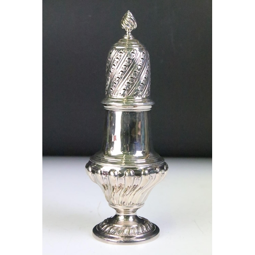 586 - 19th Century Victorian silver hallmarked sugar shaker of reeded baluster form with pierced lid. Hall... 