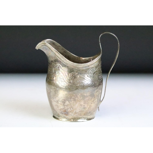 588 - 19th Century George III silver cream jug having engraved foliate scrolls and banded rim. Hallmarked ... 