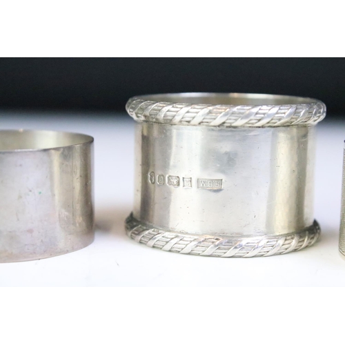 598 - Five 20th Century silver hallmarked napkin rings, the earliest dated 1919, latest 1977. All with ste... 