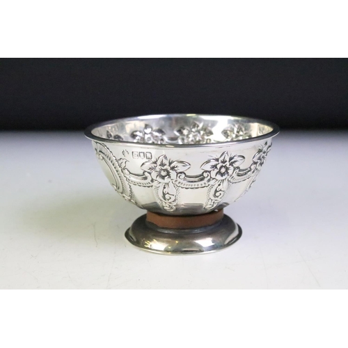 600 - Pair of silver hallmarked footed bowls having moulded floral garlands and unengrved initial panels. ... 