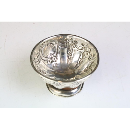 600 - Pair of silver hallmarked footed bowls having moulded floral garlands and unengrved initial panels. ... 