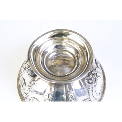 600 - Pair of silver hallmarked footed bowls having moulded floral garlands and unengrved initial panels. ... 