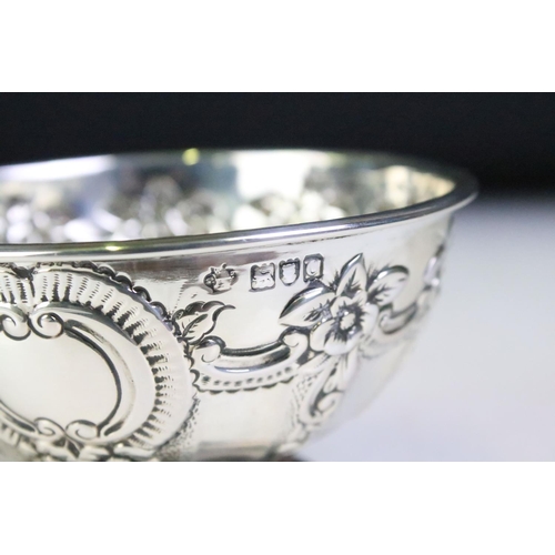 600 - Pair of silver hallmarked footed bowls having moulded floral garlands and unengrved initial panels. ... 