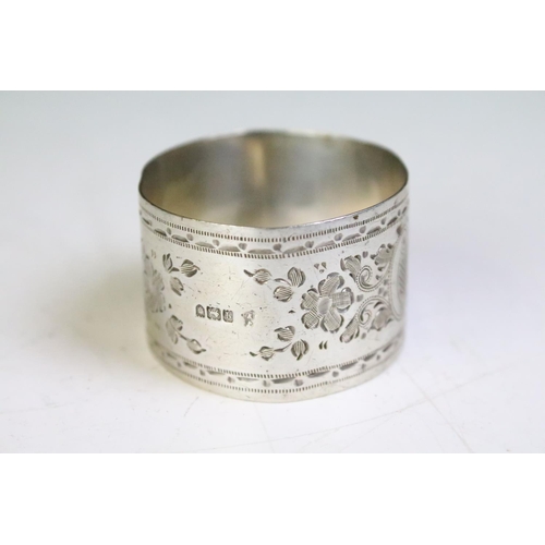 601 - Five silver hallmarked 19th Century and later napkin rings. Four having engraved foliate detailing a... 