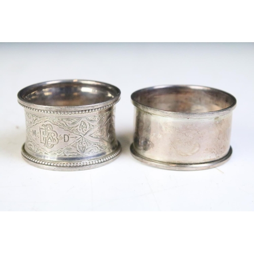 601 - Five silver hallmarked 19th Century and later napkin rings. Four having engraved foliate detailing a... 