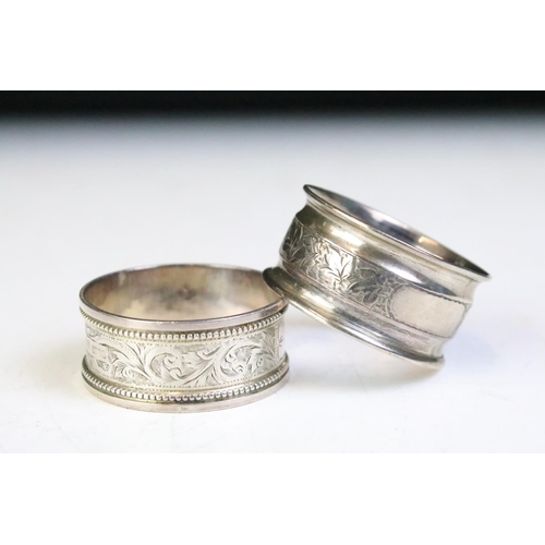 601 - Five silver hallmarked 19th Century and later napkin rings. Four having engraved foliate detailing a... 