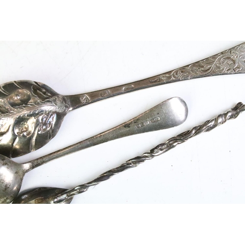 606 - 18th Century Georgian berry spoon having repousse fruit to the bowl and scrolled leaf detailing to t... 