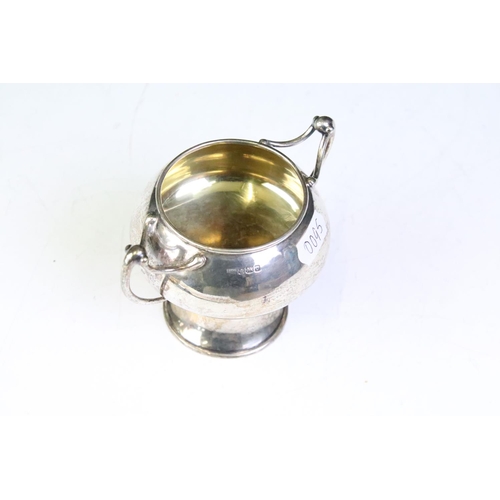 612 - Early 20th Century Edwardian arts and crafts style twin handled cup. The cup having a pedestal base ... 