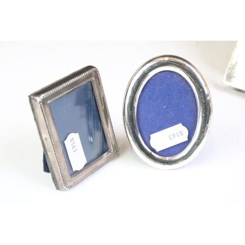 615 - Group of silver fronted photo frames to include a large rectangular example, two oval frames (one AF... 